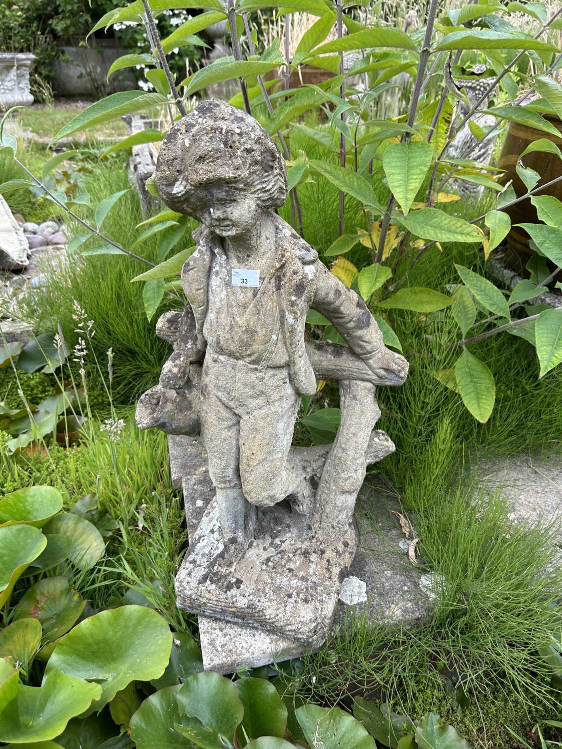 Composite garden water feature formed as a boy, height approx 80cm