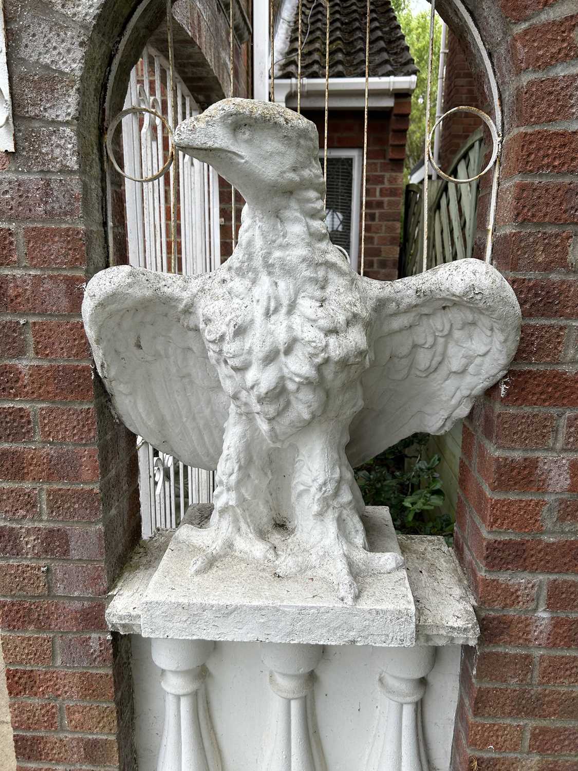 Composite garden statue formed as an eagle, height 80cm, width approx 65cm