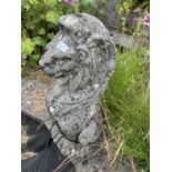Composite garden statue formed as a seated lion, height approx 65cm