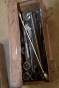 Metal tool box containing a quantity of mixed large gauge spanners