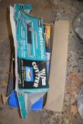 A boxed professional tile cutter together with a boxed mitre saw