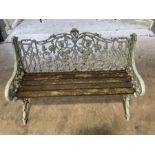 A Victorian cast iron garden bench, in the manner of Coalbrookdale, fruiting vine design,