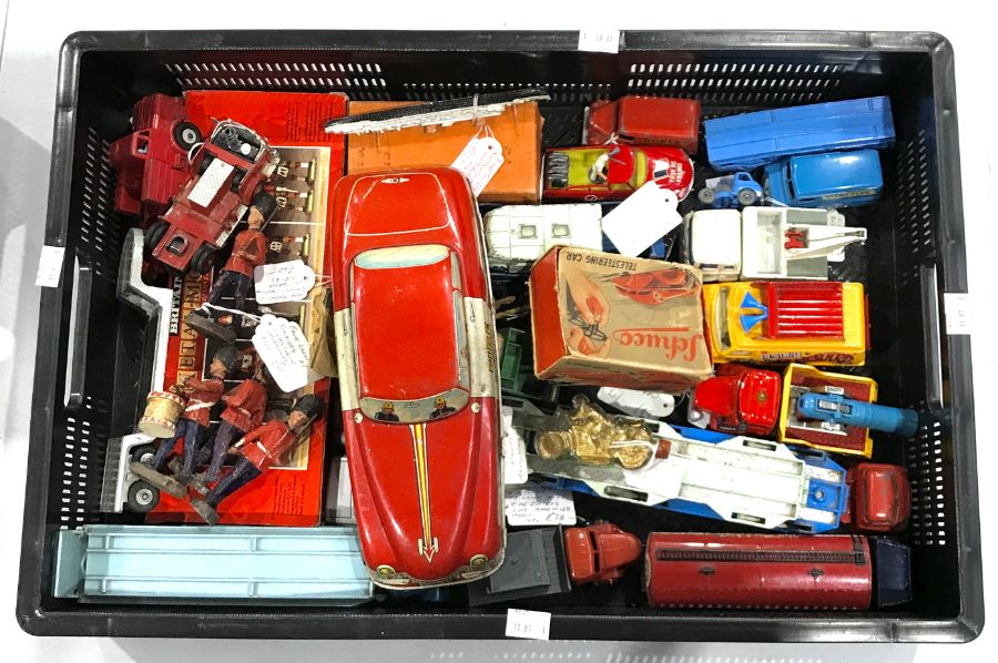 A collection of model cars and toy soldiers, to include tin plate Fire Chief's car, four Elastolin