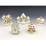 Five 19th Century pastille burners, to include a triple group of Regency Gothic villas, possibly