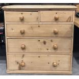 A pine chest of two short over three long drawers 92cm wide, 94cm high