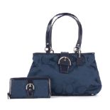 Coach, a blue Soho Signature handbag and matching purse