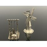 Two Dutch silver novelty mechanical toys, one modelled as a windmill with rotation sails, the