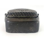 A large Chinese bronze hand warmer, Qing Dynasty, swing handle, geometric pierced cover, rectangular