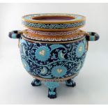 Christopher Dresser for Minton, a large Aesthetic Movement majolica twin handled jardiniere