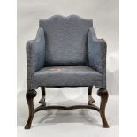 An Edwardian upholstered hall armchair, circa 1910, 'moustache' top rail, downswept arms, cabriole