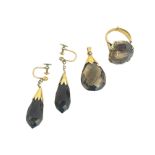 A gold mounted smoky quartz set of earrings, pendant and ring