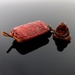A carved red lacquer three case inro, 19th Century, one side carved with a pair of scholars in an
