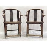 A pair of Chinese horseshoe-back wooden armchairs, North China, late Qing Dynasty, curved and