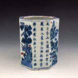 A Chinese blue and white porcelain brush pot, Qing dynasty, octagonal form with the Three Friends of