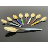 A harlequin set of eight Norwegian Modernist silver gilt and enamelled coffee spoons and a larger