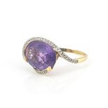 An 18 carat gold amethyst and diamond ring