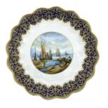 Stefan Nowacki for Lynton, a large painted and gilt porcelain charger, dished with crimped rim,