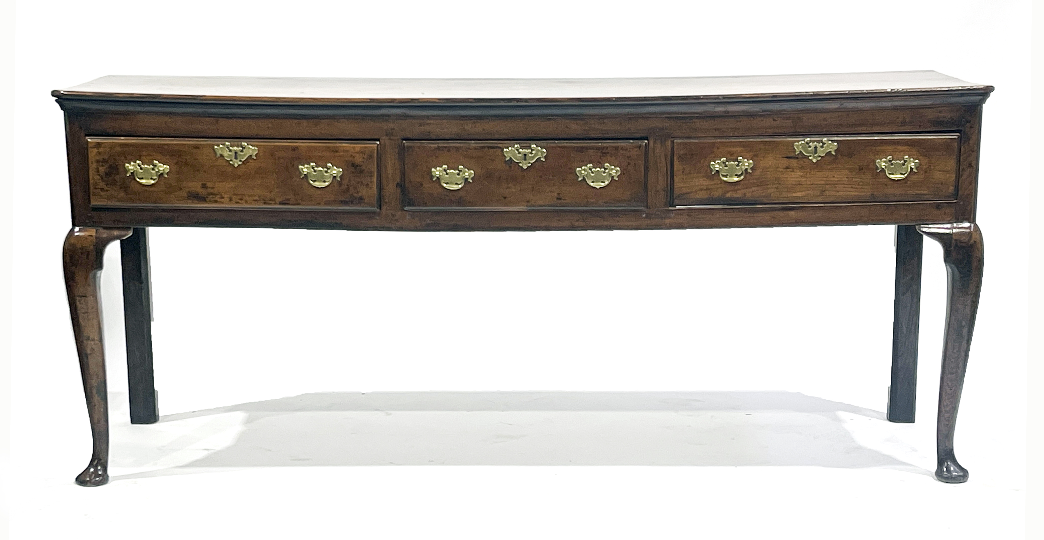 A George III country oak standing dresser base, circa 1760, moulded top with canted corners,