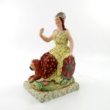 A Staffordshire figure of Britannia, late 19th century, modelled seated in a floral and patterned