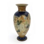 A Royal Doulton stoneware vase, circa 1905, inverse baluster form, tubelined with leaf and berry