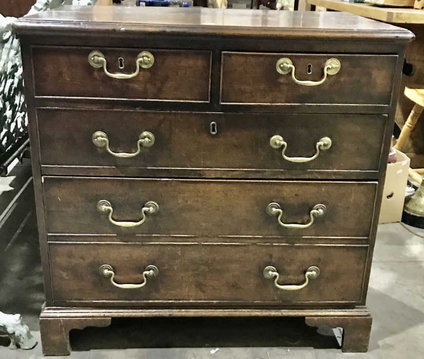 A George III country oak chest of drawers of small proportions, circa 1800, moulded top, two short