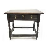 A late Charles II oak side table, circa 1680, moulded top, single long frieze drawer with double
