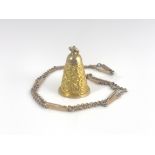 An 18 carat gold bell pendant
