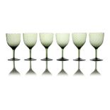 Harry Powell for James Powell and Sons, Whitefriars, a set of six Arts and Crafts green glass wine g