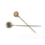 Two gold and gem set stick pins