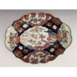 A Worcester Imari palette dish, circa 1770, lobed lozenge form, painted pagoda and prunus blossom,