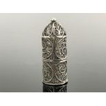 A silver filigree and glass miniature scent bottle, the facet cut and stoppered flask contained
