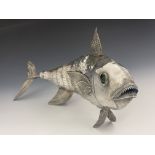 A Continental silver sculpture modelled as a fish, articulated body with simulated scales and