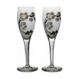 Emile Galle for Perrier Jouet, a pair of Belle Epoque enamelled glass Champagne flutes