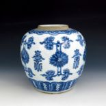 A Chinese blue and white ginger jar, Kangxi period, painted with a frieze of alternating script