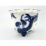 Christopher Dresser for Minton, an Aesthetic Movement relief moulded blue and white jardiniere