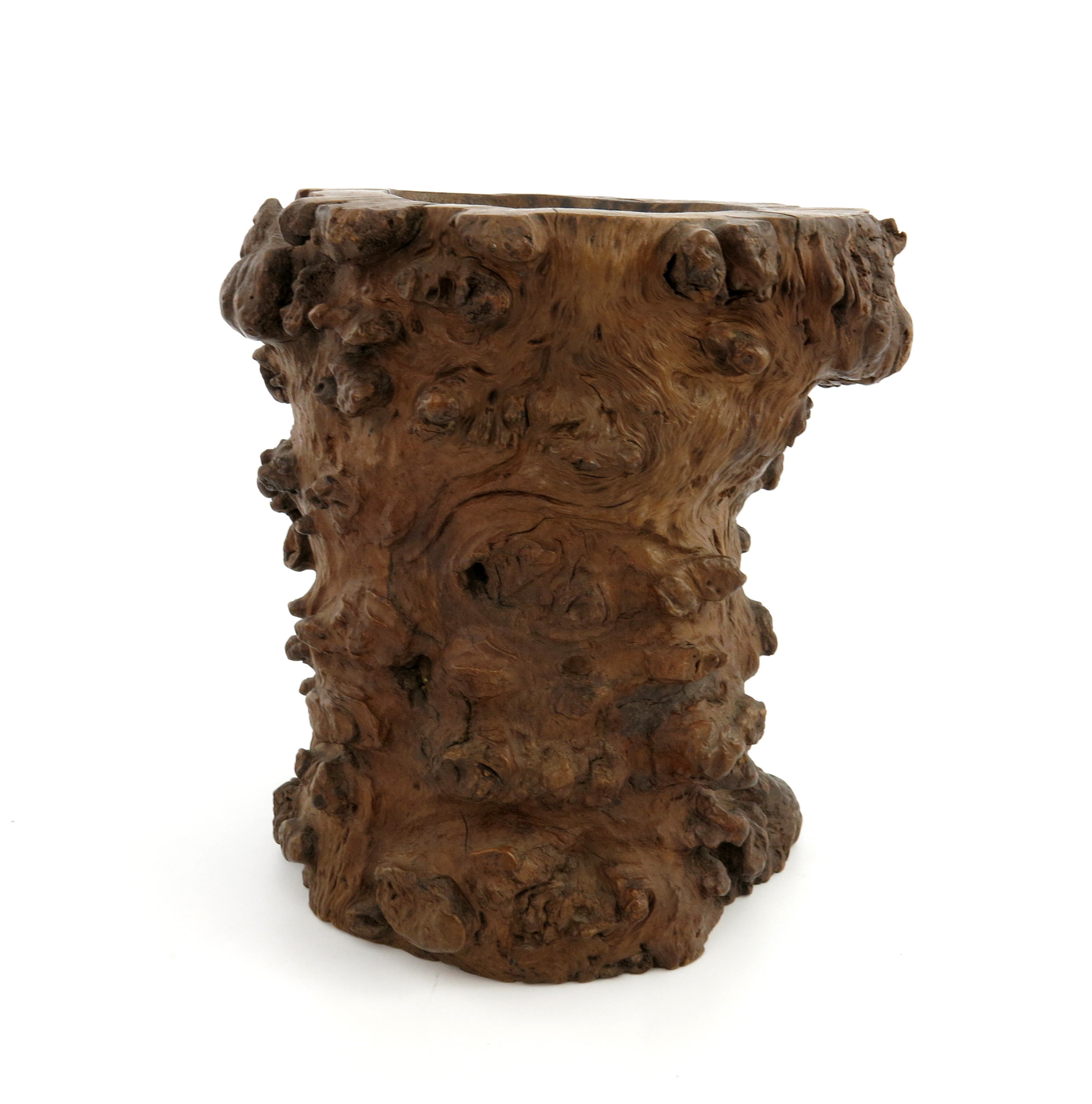 A Chinese burrwood root-form brush pot, Qing Dynasty, of gnarled and knotted shape, 20cm high