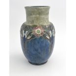 A Royal Doulton stoneware vase, shouldered form, tubelined with stylised arcades of flowering trees,