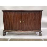 A 19th Century mahogany campaign sideboard, moulded canted corner serpentine top with hinge action