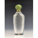 An enamelled yellow metal mounted cut glass scent bottle