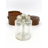 Sporting Interest, a George V giant triple flask set, clear cut glass segment bottles with