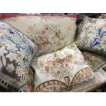A collection of decorative soft furnishings, including Aubusson style feather filled cushions and