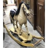 An antique German style rocking horse, horse hair, carved and stuffed body, carved and painted