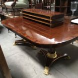 A reproduction Empire style twin pedestal extending D end dining table, crossbanded and Ebony strung