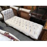 A French giltwood day bed, chenille buttoned upholstery on foliage moulded cabriole supports,