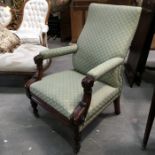 A William IV carved mahogany armchair, with green and gold diaper upholstery, on floral carved