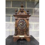 An Austrian carved walnut trumpet table clock, clock movement signed GHS, Gordian Hettich Sohn,