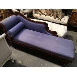 An Victorian scroll end purple upholstered chaise longer on turned supports, 183cm long x 88cm