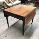 A Regency mahogany and crossbanded Pembroke table, fitted single drawer and dummy drawer on rope