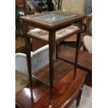 A late 19th century rosewood bijouterie table, brass framed bevelled glass lid, on slender tapered