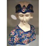 An Art Deco Longwy style ceramic bust, enamelled prunus and turquoise ground